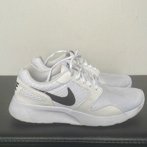 White Nike running shoes